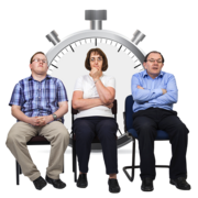 Three people waiting with a clock behind them