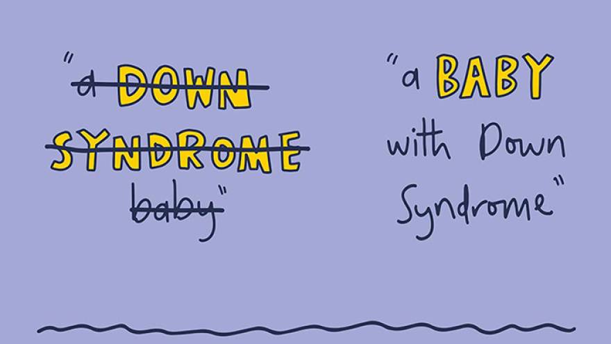 Writing with text "A Down Syndrome baby" crossed out, with the text "a baby with Down Syndrome" visible next to it.