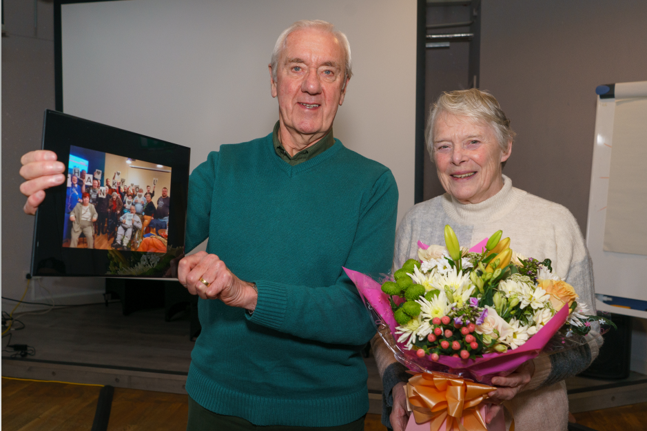 Ken and Lynda Corker receiving thank you gifts at Wirral Mencap’s AGM