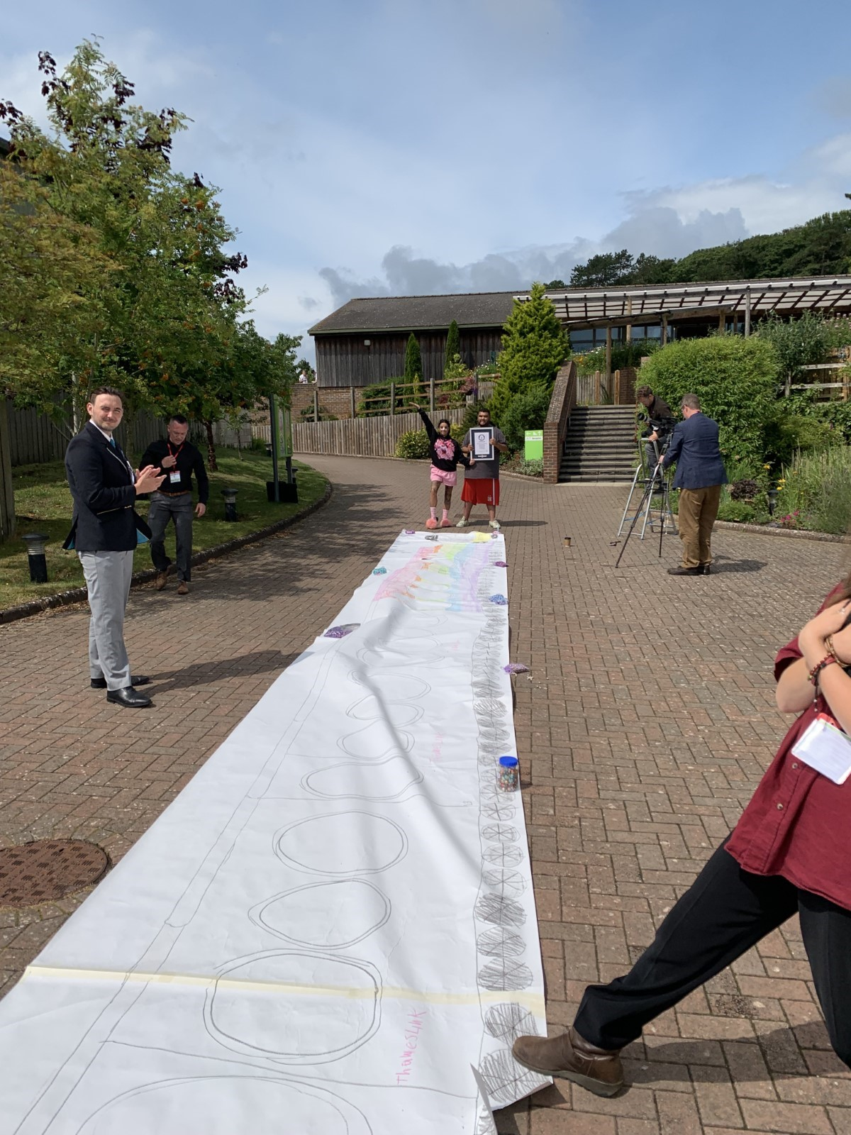 The 20 metre long drawing of a train is unrolled for display