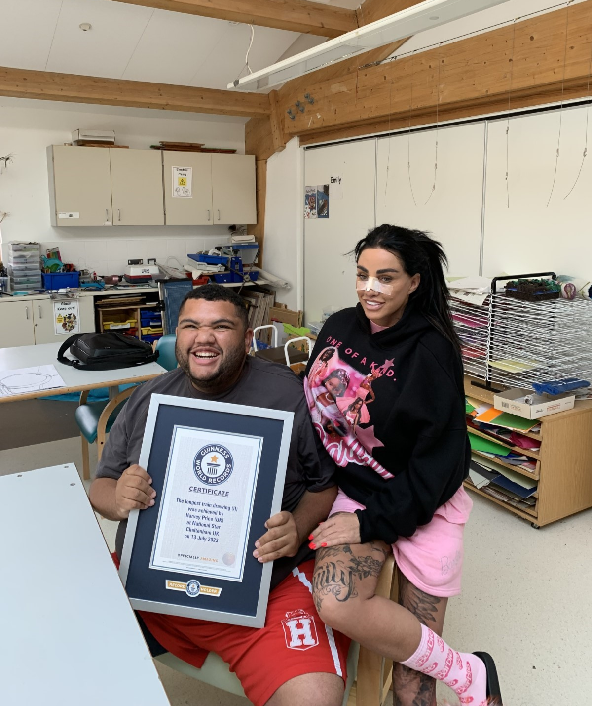 Harvey proudly shows off his Guinness World Record next to his mum