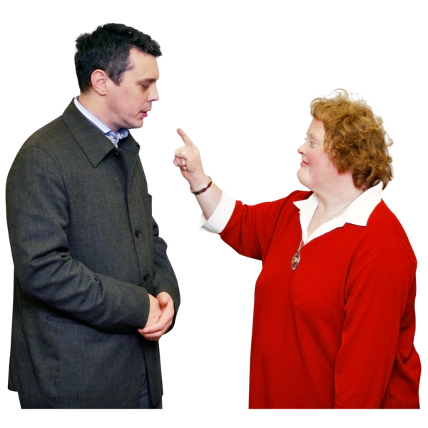A woman looking angry and waving her finger at a man 
