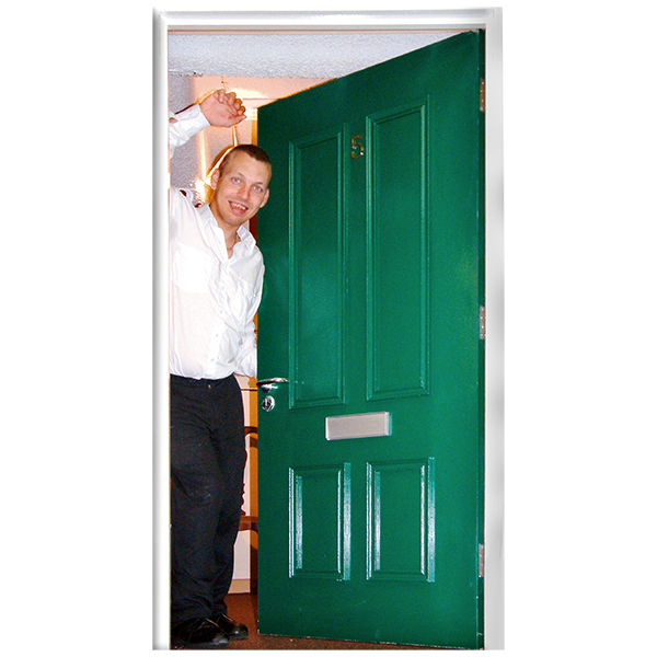 A tenant opening the door of his rented home