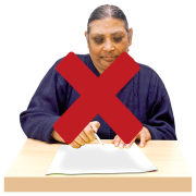 a cross through a picture of a woman filling out a form