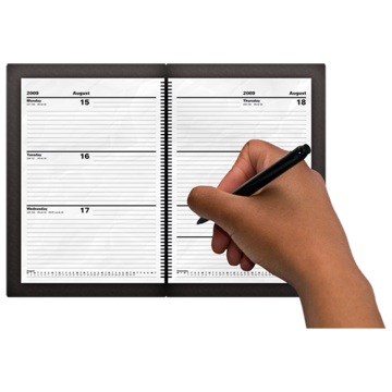 A hand can be seen writing in a diary
