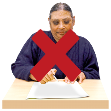 A cross through a picture of a lady filling out a form