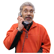 Man talking on the phone wearing an orange jumper