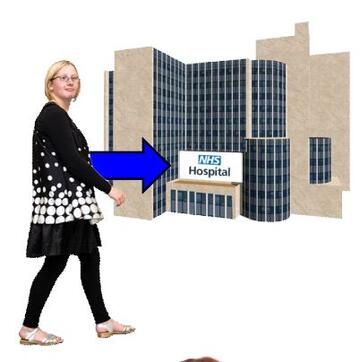 A woman walking towards a hospital