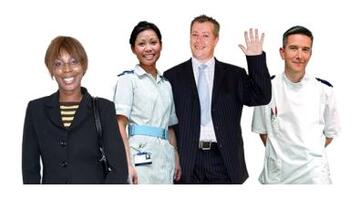 A group of healthcare workers. One is waving.