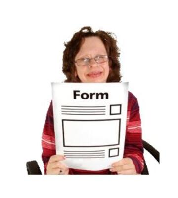 A woman holding up a form