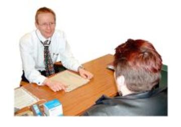 A patient talking to his doctor sitting at a desk