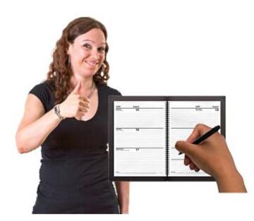 A woman with her thumbs up next to an open diary