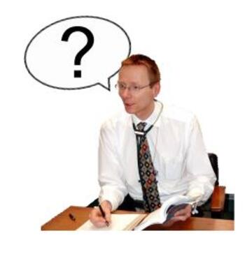 A doctor at a desk asking a question