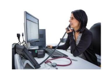 A doctor at a desk on the phone
