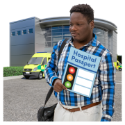 Man holding his hospital passport standing outside a hospital