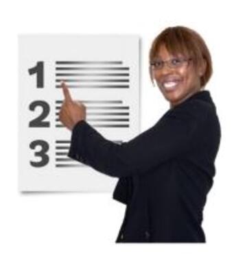 A woman pointing to a list on a wall