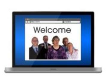 A laptop showing a screen which says Welcome.