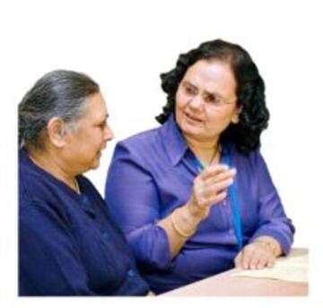 A woman explaining something to an older woman