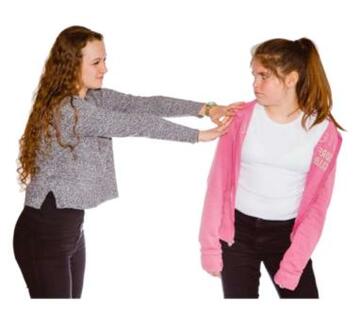 A girl pushing another girl