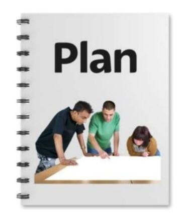 A notebook with the word 'Plan' on the cover