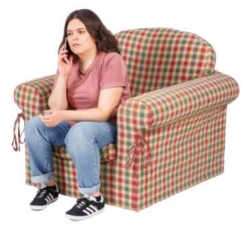 A young woman sitting on a lounge chair on a mobile phone