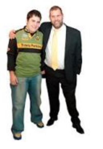 A man with his arm around another man to reassure him