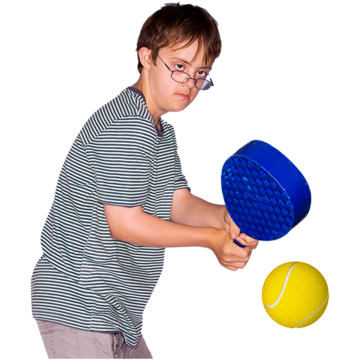 A boy playing with a bat and ball.