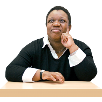 A woman sitting at a desk thinking