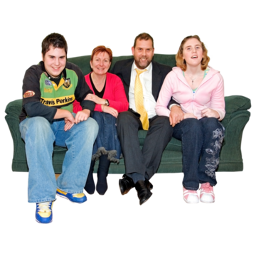 Parents sitting on a sofa with their two children
