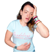 A lady holding her stomach with 1 hand and holding her head with the other hand.  She looks unhappy.