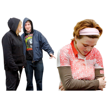 A woman walking away from two bullies looking sad with her arms folded