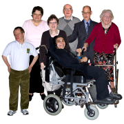 A group of people of various ages and ethnic origins, including a lady in a wheelchair.