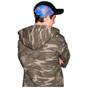 A person in a hat and coat with their back turned