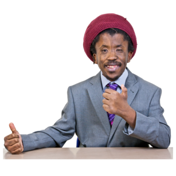 A man at a desk smiling with his thumbs up