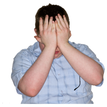 A man with his hands over his face.