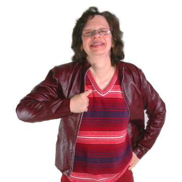 A woman smiling and pointing proudly at herself.