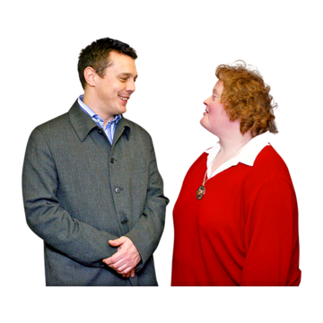 A smiling man with a woman who has a learning disability