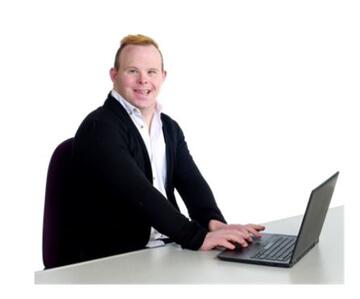 a man with downs syndrome at a laptop