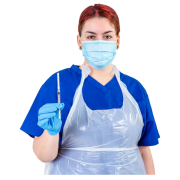 A nurse wearing a facemask and an apron is holding a needle ready to give an injection.