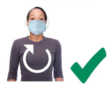 A woman breathing normally whilst wearing a face covering