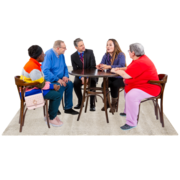 Five people in a meeting sitting around a table