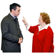 A woman waving a pointed finger at a man
