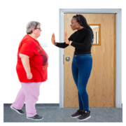 A woman stopping another woman from going through a door