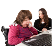 A woman talking on the phone with a support worker next to her