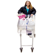 A woman pushing a shopping trolley full of shopping bags