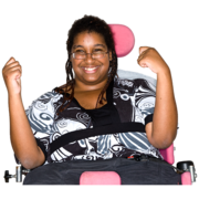 A lady in a wheelchair smiling.