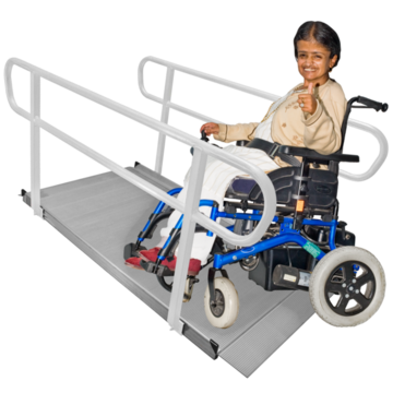 A woman in a wheelchair using a ramp to go up to another level