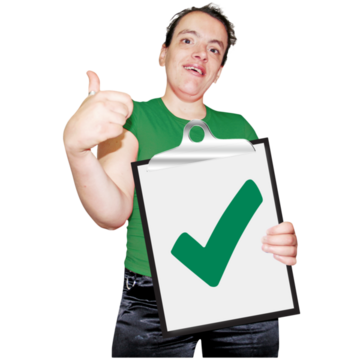 A girl in a green top holding her thumb up and holding a clipboard with a green tick on it with the other hand
