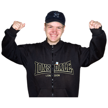 A man in a baseball cap celebrating with his hands in the air