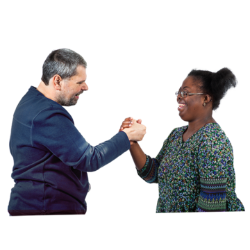 A man and a woman holding hands in the air celebrating